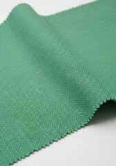 a close up of a green fabric on a white background