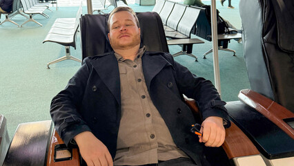 A relaxed Caucasian man in a lounge chair, capturing the serene essence of National Relaxation Day and Hygge contemplation