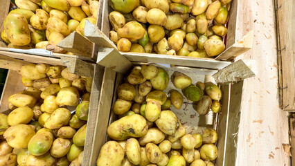 Rustic spuds nestle in wooden crates, echoing autumnal harvest festivals and ancestral agricultural...