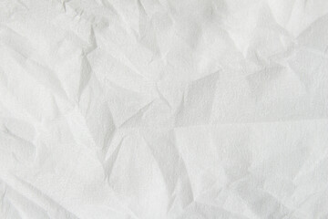 Wrinkled white paper texture background close-up