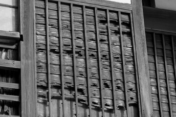 The exterior walls of an old house that has endured the wind and snow and is steeped in history