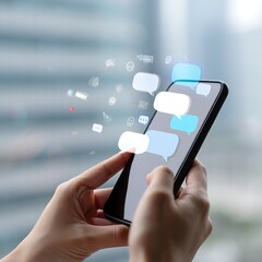 Hands holding smartphone with messaging icons and social media notifications representing digital communication and interaction in modern society