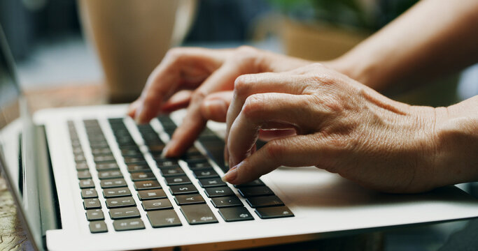 Hands, typing and creative with laptop, office and reporter with article on website and publication. Research, online and person with tech for story, journalism and project with keyboard in newsroom