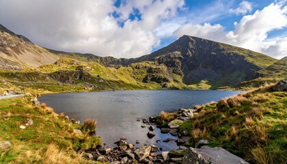 Mountain lake, dramatic scenery, sunlight on peaks