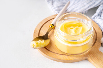 Homemade ghee butter in small glass jar