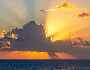 Golden sunset, dramatic clouds over ocean