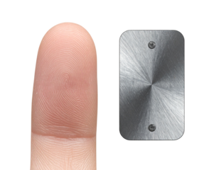 Close-up Studio Photo of Human Index Finger and Metal Tag