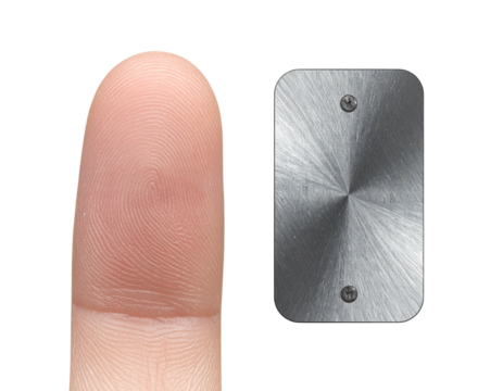 Close-up Studio Photo of Human Index Finger and Metal Tag