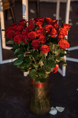 Lush Red Rose Bouquet in Golden Vase  Romantic Flowers, Valentines Day Gift, Deep Crimson Tones, Dark Background, Elegant Floral Arrangement.