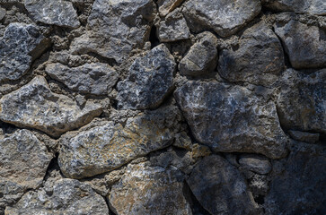 Dark stone wall with backlight texture