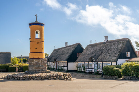 Bell tower and traditional thatched houses in Nordby Sams� Denmark