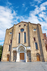 San Francesco Basilica stands prominently in Bologna's Piazza San Francesco, highlighting its unique brick facade and striking architectural details. Bologna, Province of Ferrara, Italy
