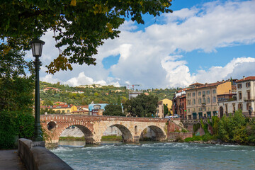 The Ponte Pietra in Verona, Italy, an ancient Roman stone arch bridge spanning the Adige River in the Veneto region, a timeless symbol of classical architecture and historic heritage