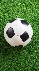 Fototapeta premium Vibrant green grass texture ideal for professional sports, offering a stunning backdrop for football activities in a bright setting