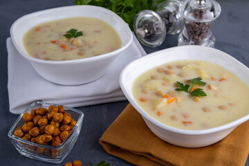 Two bowls of cheese soup with chickpeas. A diet rich in protein.