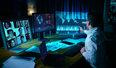 Professional analyzing info on futuristic virtual screens during video conference. Concept of...
