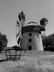 old windmill on the hill in black and white photo wallpaper design