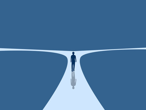 People walking at a fork in the road with two choices