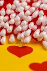 sticks with white cotton for hygienic procedures, red sticks with natural white cotton at the ends for personal hygiene