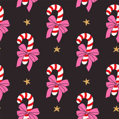 Colorful candy canes with bows and stars create a festive holiday pattern for cheerful celebrations
