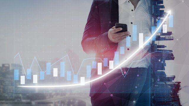A businessman in a suit holds a smartphone against a city backdrop, with a financial growth graph overlay, symbolizing progress in the modern business landscape. Copula - Powered by Adobe