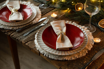 Elegant Christmas table setting. Festive table decorated for Christmas dinner.