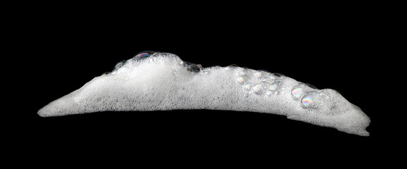 liquid white foam soap, shampoo, or shower gel. Abstract bubbles. isolated on a black background....