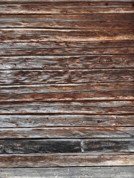 Background: old, weathered brown wood structure