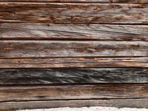 Background: old, weathered brown wood structure