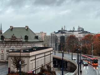 Modern Tram and Historic Architecture near a Major Roadway in Warsaw