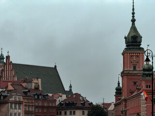 Old Town Rooftops and Clock Tower on a Cloudy Day in Warsaw, Poland