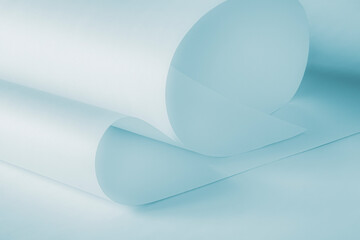 Long sheets of paper from a roll of blue tone. Soft pastel image. Can be used as a background.