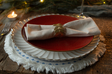Beautifully adorned table for Christmas dinner. Holiday season table setting.