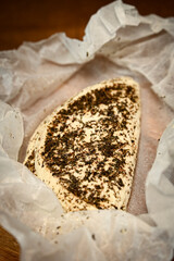 Craft cheese cut into pieces on a cutting board