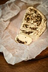 Craft cheese cut into pieces on a cutting board