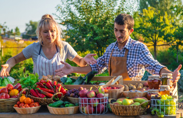 Man and woman at a farmers market. Selective focus.