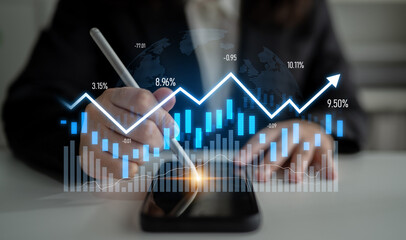A business professional studies financial market trends with a smartphone display, showcasing...