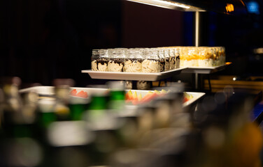 Delicious desserts in jars served to guests in the restaurant