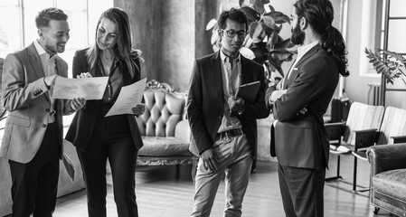 Multiracial people working inside business elegance office - Corporate, team meeting and brainstorming - Focus on asian man face - Black and white editing