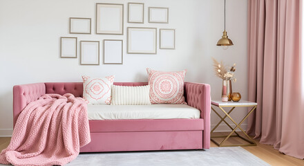 Pink velvet daybed with throw blanket and decorative pillows