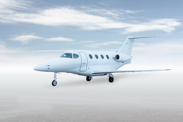 Modern white private jet isolated on bright background with sky