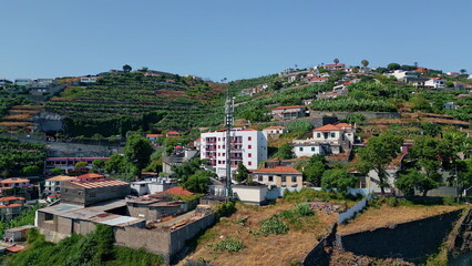 Picturesque city scattered slopes in mediterranean landscape drone view.
