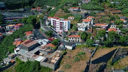Aerial mediterranean town neighborhood covered greenery. Transport moving road 