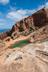 Yemen, Middle East: aerial view of the wadi (mountain lake) of the Dragon Blood trees forest in Homhil Plateau protected area on the island of Socotra, Unesco world heritage site for its biodiversity
