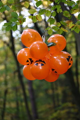 Halloween Jack-o'-lantern Balloons in an Autumn Forest