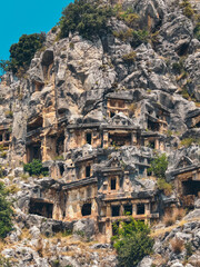 Rock-cut tombs of the ancient Lycian necropolis. Myra is an antique town in Lycia where the small town of Kale (Demre) Turkey. Close-up of rock cut tomb grave.