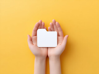 Hands cupping around white file folder icon on bright yellow background, symbolizing data protection and care