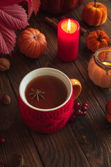 Cozy Autumn Scene with Mulled Wine, Candles, Pumpkins and Seasonal Decor