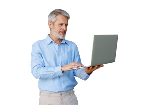 Senior grey-haired businessman focused on laptop, typing and working online in casual shirt, isolated on transparent background