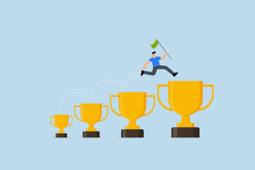 achievement to motivate to achieve bigger goal, businessman jumping from small win trophy to get bigger one.